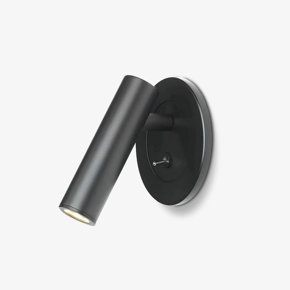 Reading wall lamp with adjustable arm mounted beside a bed