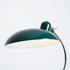 Close view of the cream-lined underside of the green dome shade on this Clérachic desk lamp.