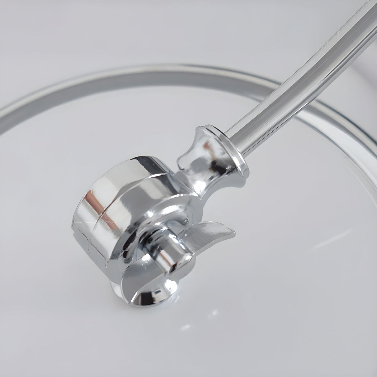 Close-up of the chrome ball joint and curved stem on this Clérachic desk lamp.