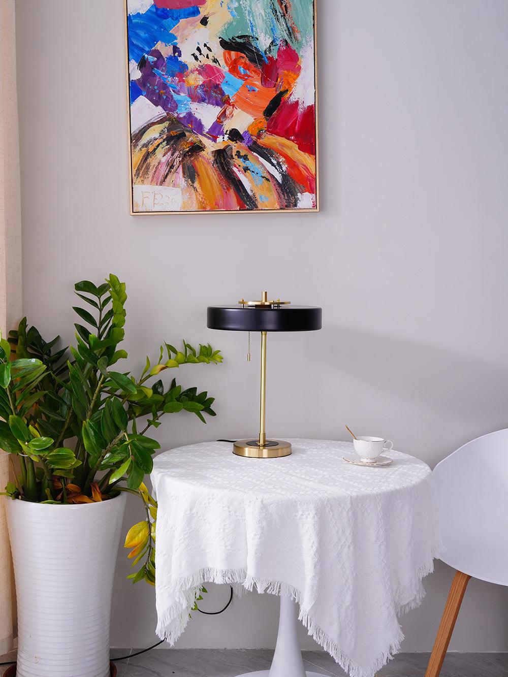 Revolve table lamp styled in a living room corner