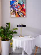 Revolve table lamp styled in a living room corner