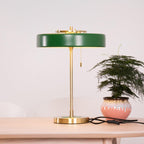 Spun metal table lamp shown from the side