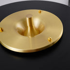 Table lamp shade and gold base shown together