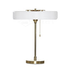 Spun metal lamp shade with soft glow at top and bottom