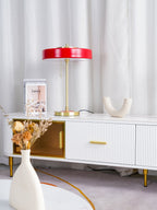 Table lamp with pull chain over a solid gold base