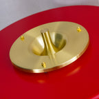 Table lamp with coloured shade and gold pull chain