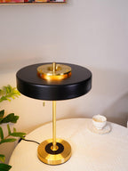 Revolve table lamp glowing in a styled interior