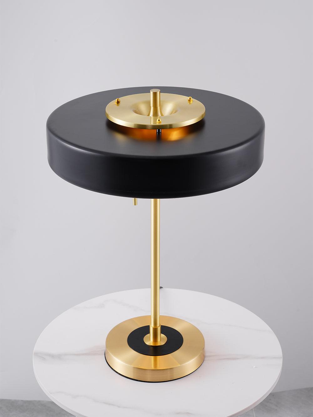 Revolve table lamp with opal diffuser lit softly