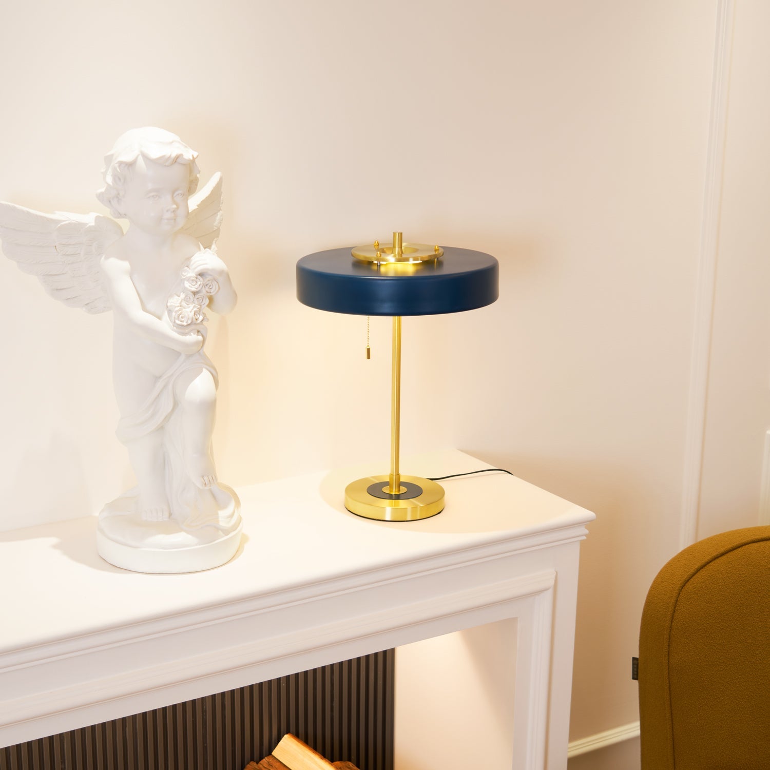 Spun metal table lamp casting warm ambient light