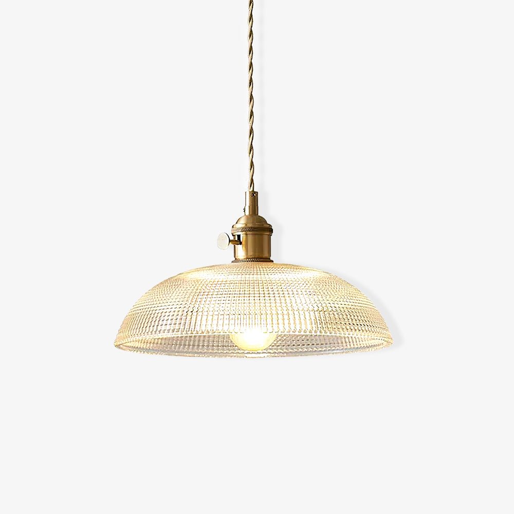 Glowing softly on a plain off-white background, this Clérachic pendant shows its ribbed shade lit from within.