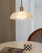 This Clérachic pendant lights a round table set with a chequered mug, a wood chair beside a curtained window.