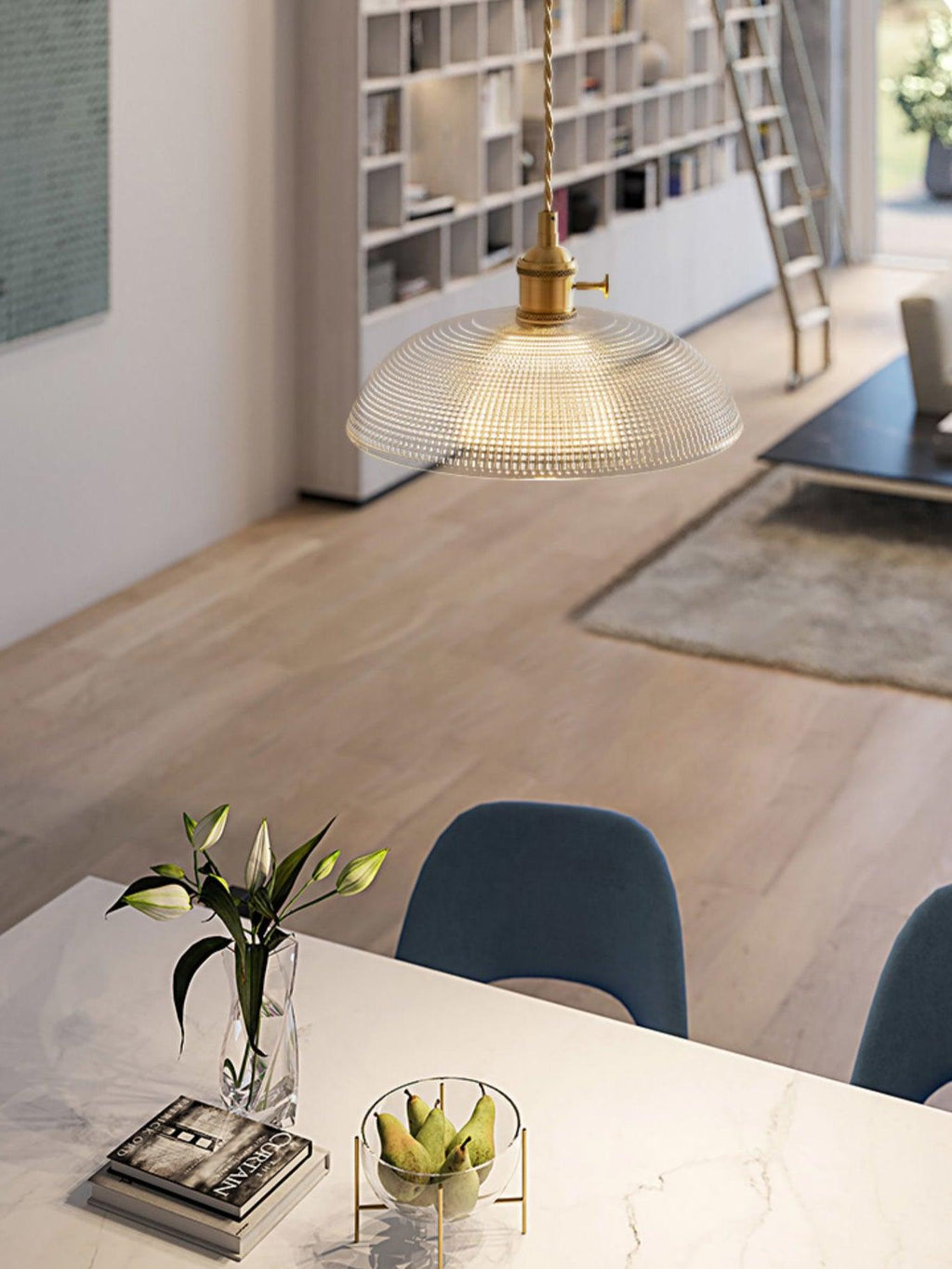 This Clérachic pendant lights a marble table set with lilies, a bookshelf and ladder visible behind.