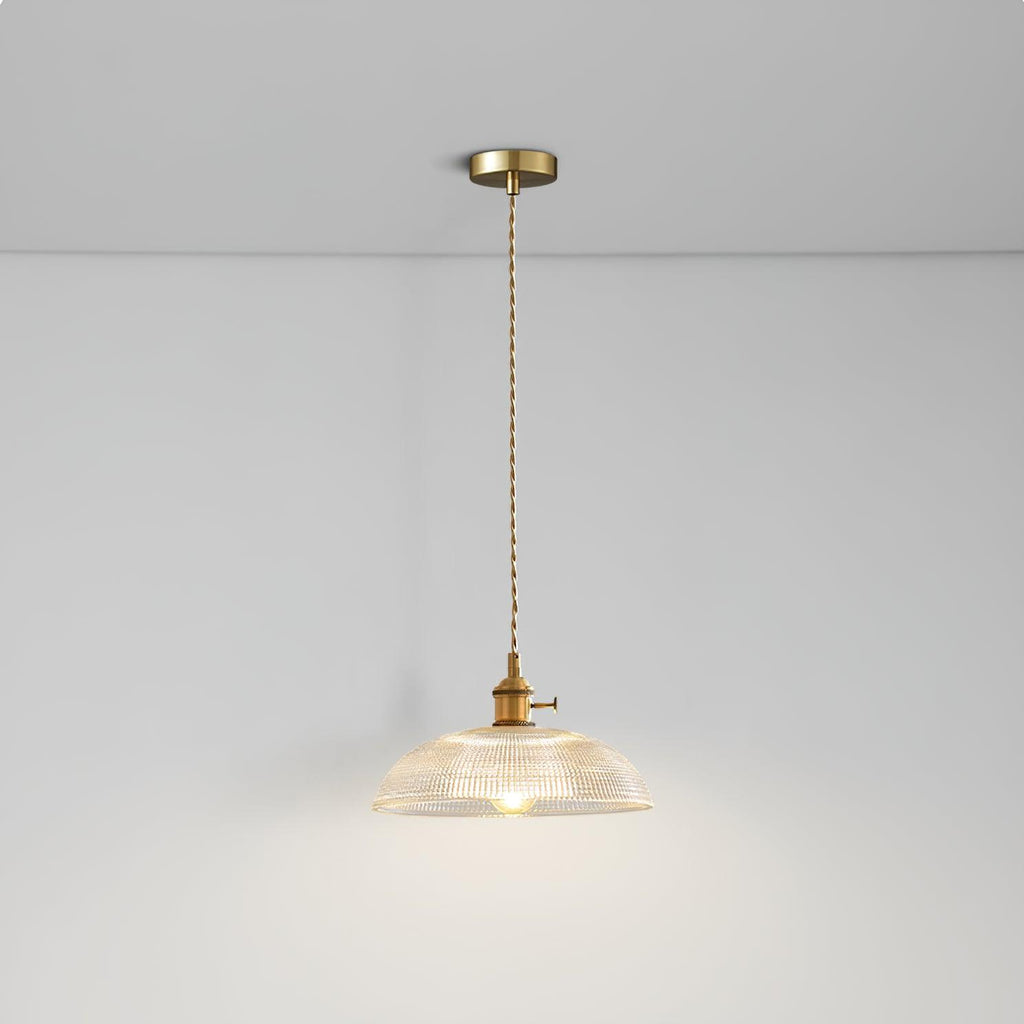 Lit from the same low angle, this Clérachic pendant's ribbed glass shade casts a warm glow across the ceiling.