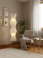 Paper floor lamp with ribbed shade in a calm interior corner