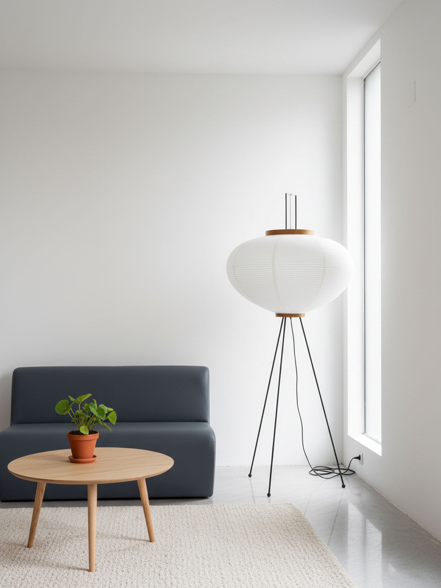 Akari floor lamp with paper shade casting warm ambient light