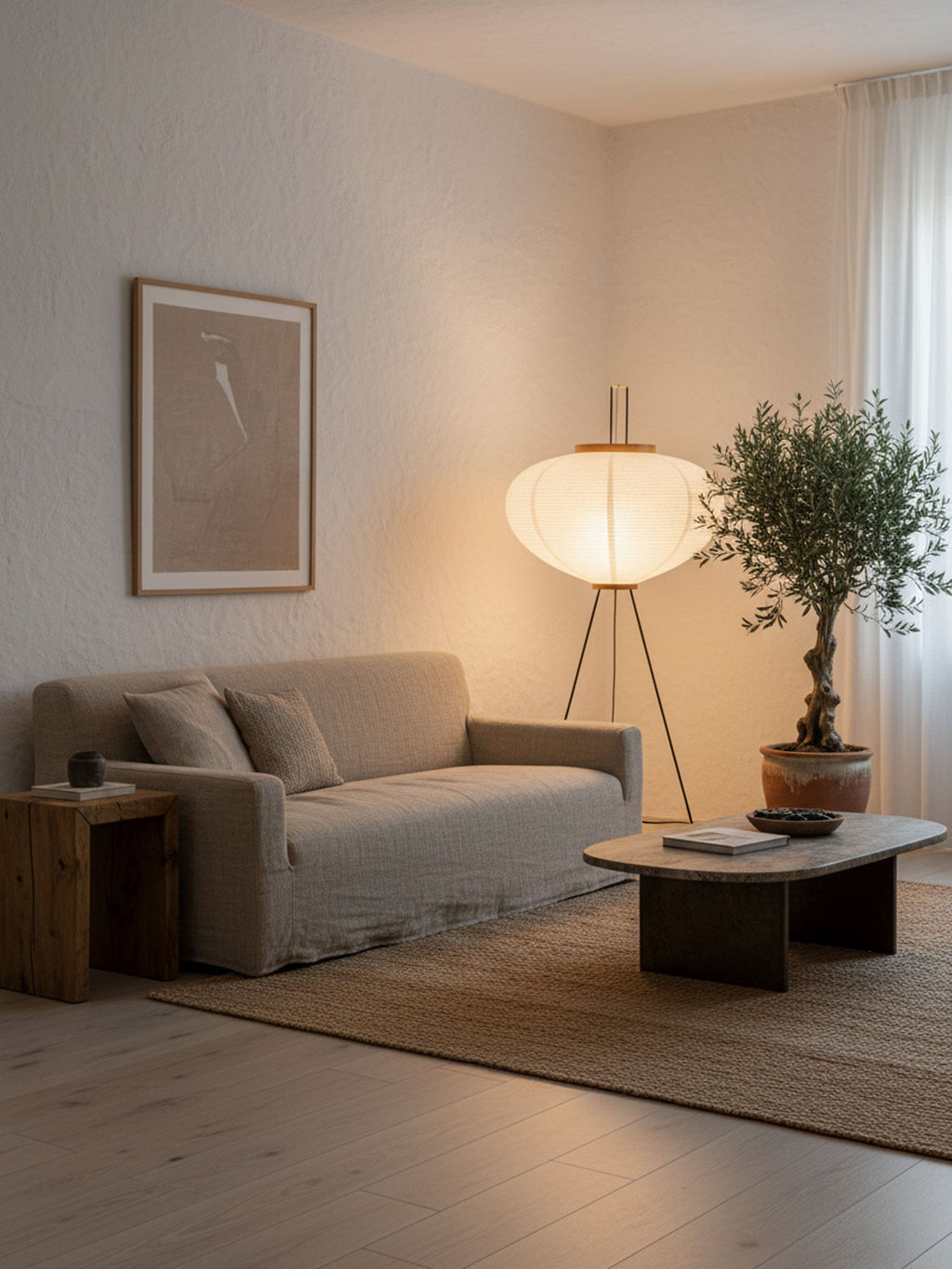 Rice paper floor lamp shown full length against a plain wall