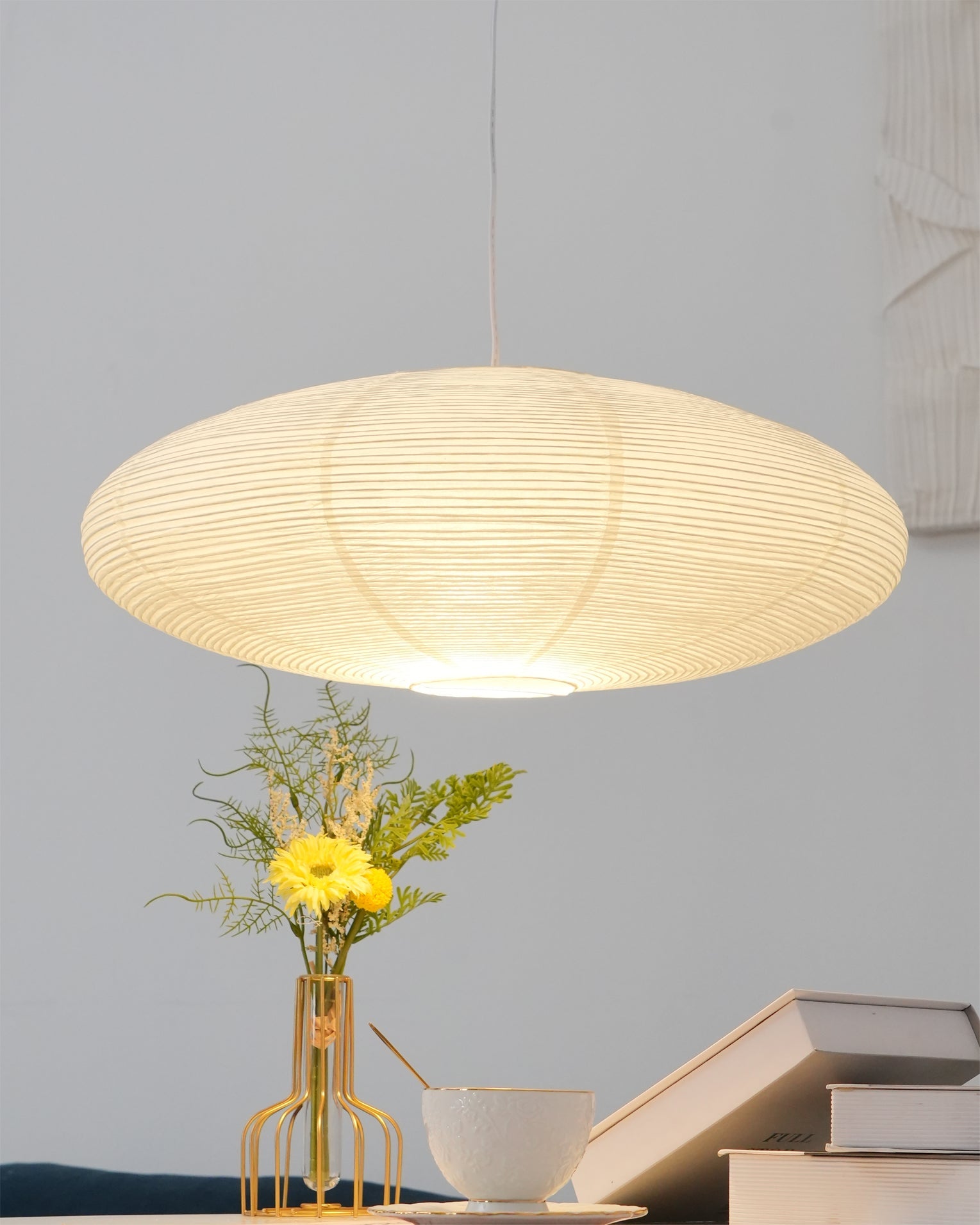 White washi paper pendant light hung above a room