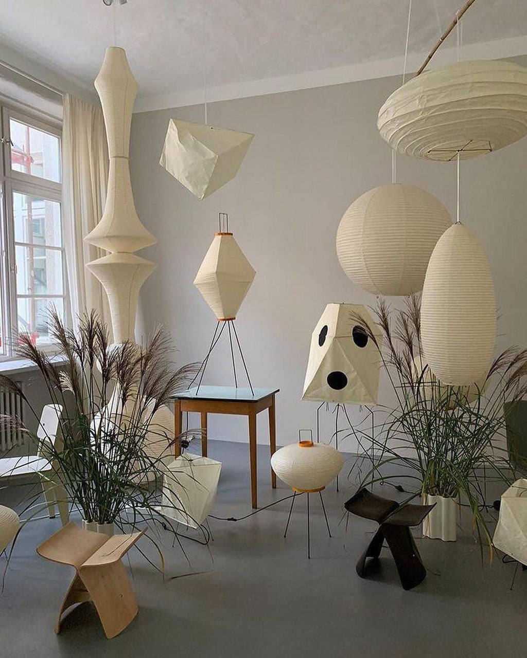 White mulberry paper pendant glowing in a bedroom