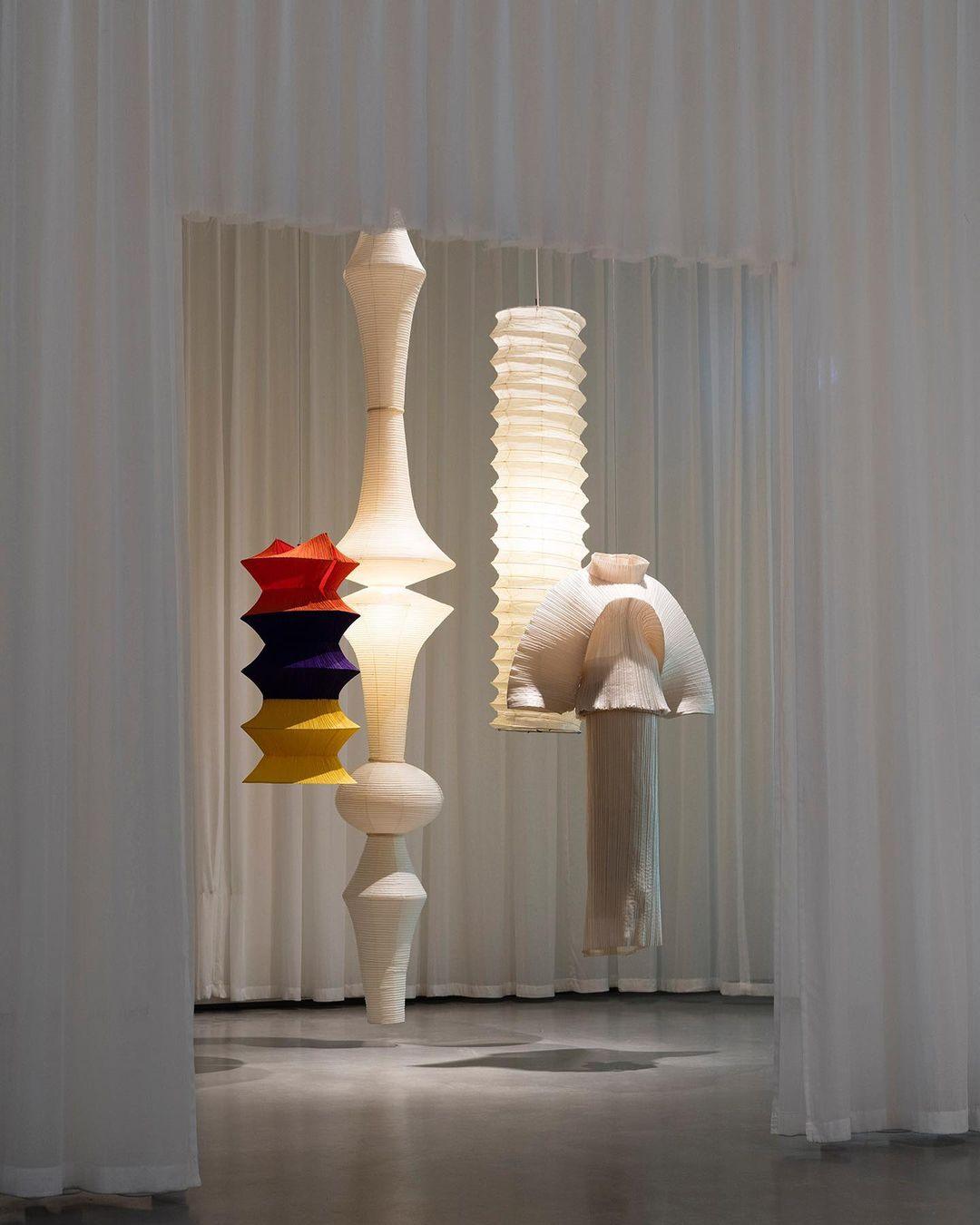 Tall washi paper pendant with warm diffused light