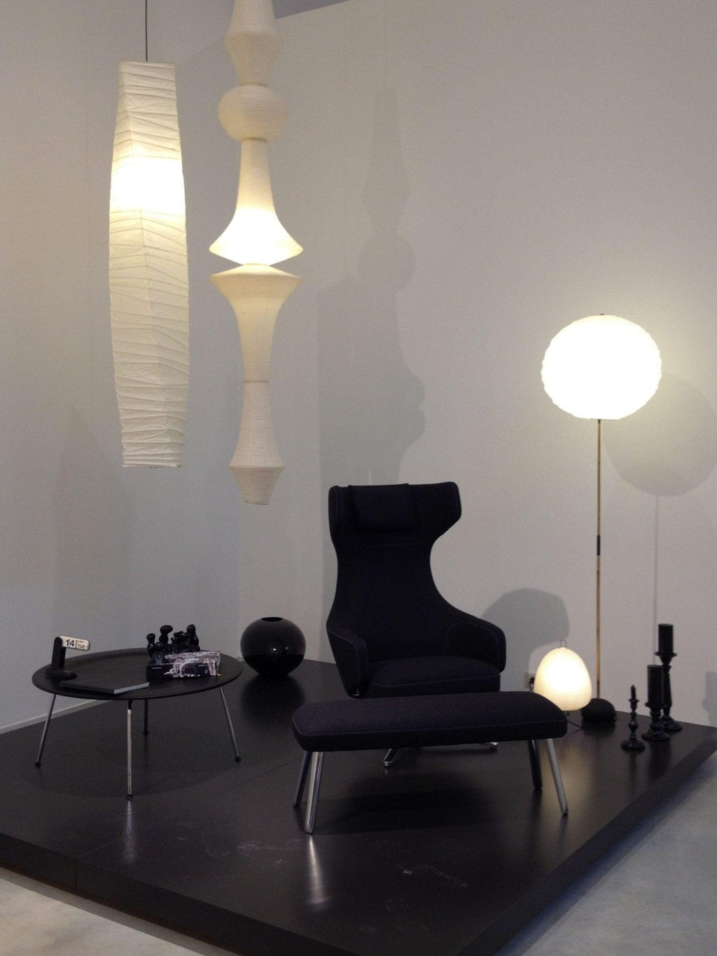 White paper pendant drop glowing in a tall space
