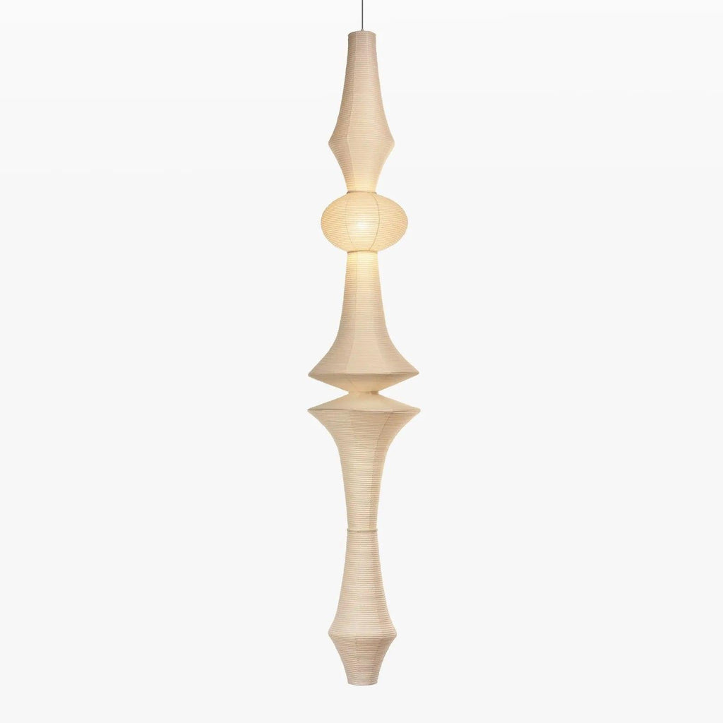 Tall mulberry paper pendant glowing in an entryway