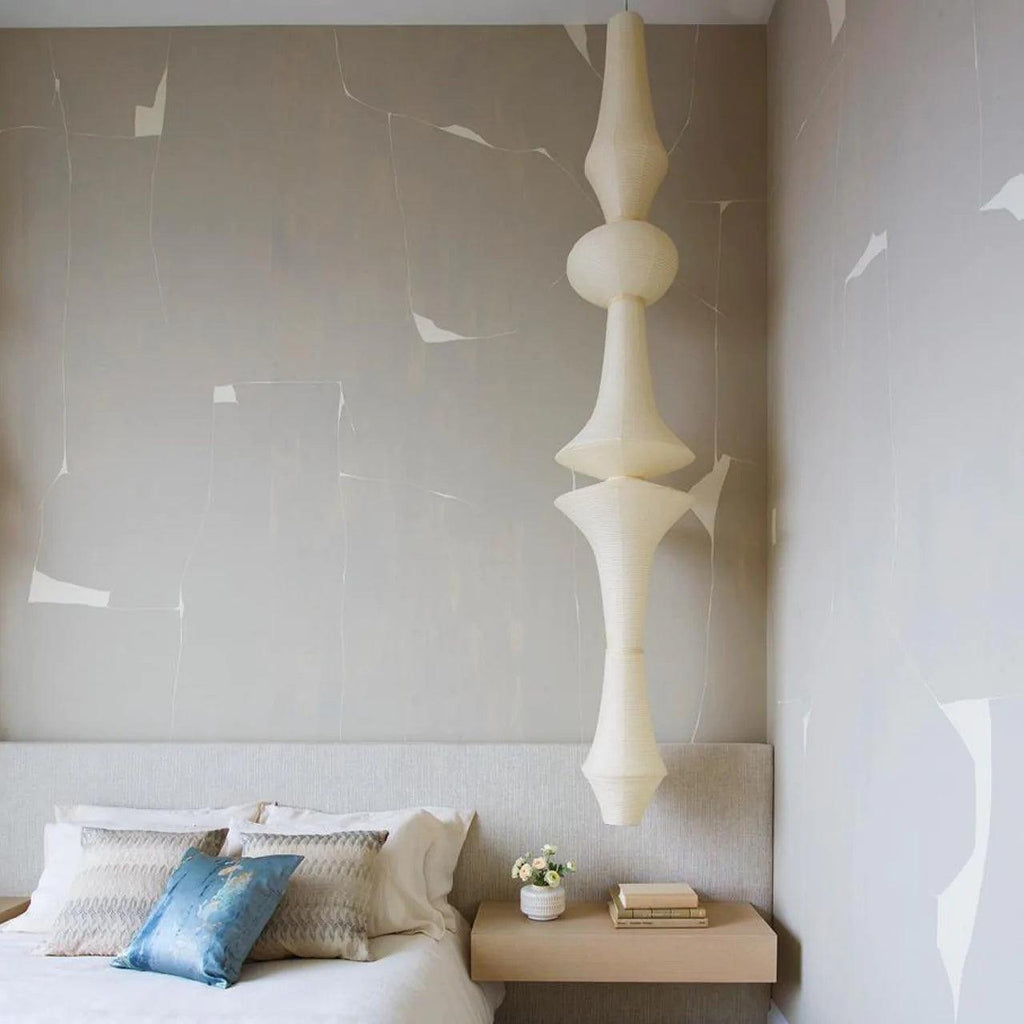 Slender washi paper pendant shade lit from within