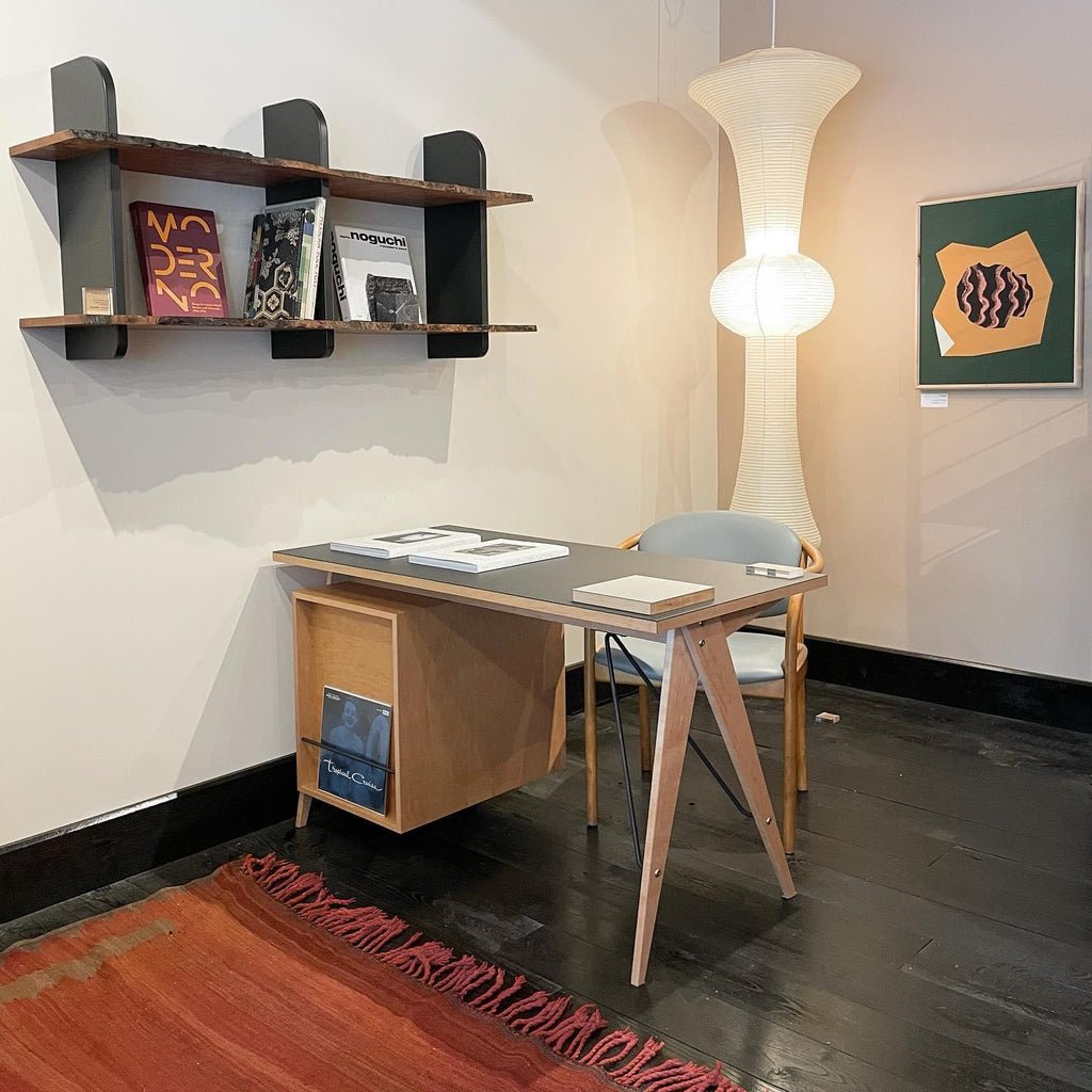 White washi paper pendant lit in a high-ceiling entry