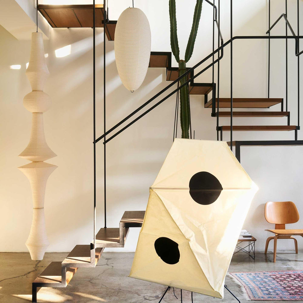 Tall washi paper pendant styled in a double-height space