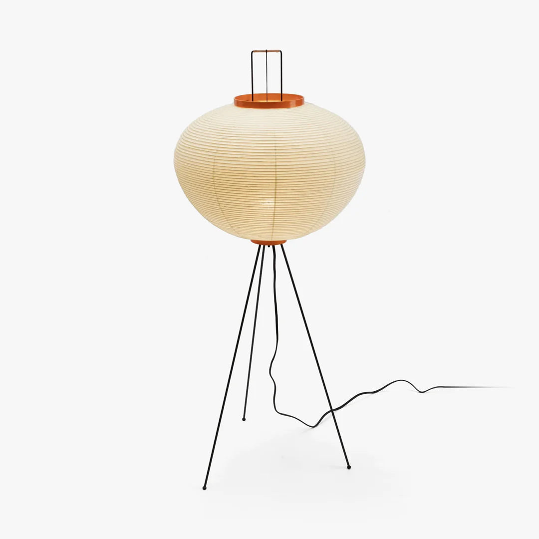 Akari rice paper floor lamp glowing softly in a calm room