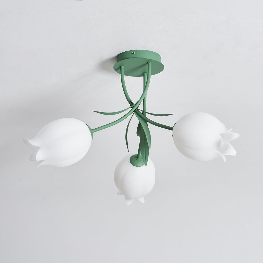 On a plain background, this Clérachic ceiling light in green is shown unlit with its three shades evenly spaced.