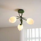 Near a sheer-curtained window, this Clérachic ceiling light in green hangs unlit with its three shades clearly visible.