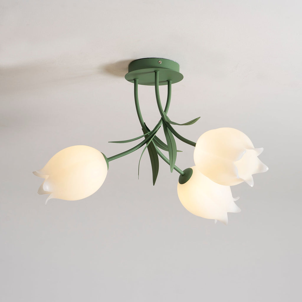 On a plain grey background, this Clérachic ceiling light in green shows its three shades overlapping slightly in view.