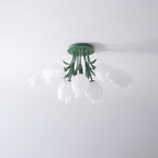 On a plain grey background, this Clérachic ceiling light in green is shown unlit from a front-angled view.