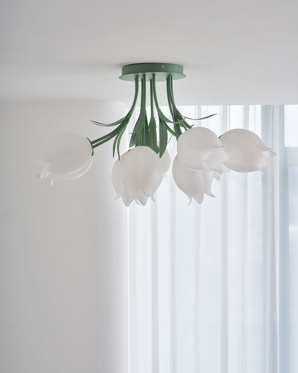 Near a bright, sheer-curtained window, this Clérachic ceiling light in green hangs with no furniture in view.