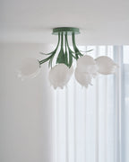 Near a bright, sheer-curtained window, this Clérachic ceiling light in green hangs with no furniture in view.