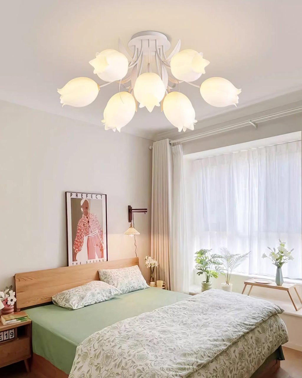 Above a bed with patterned linens, this Clérachic ceiling light in green hangs near a wall sconce.