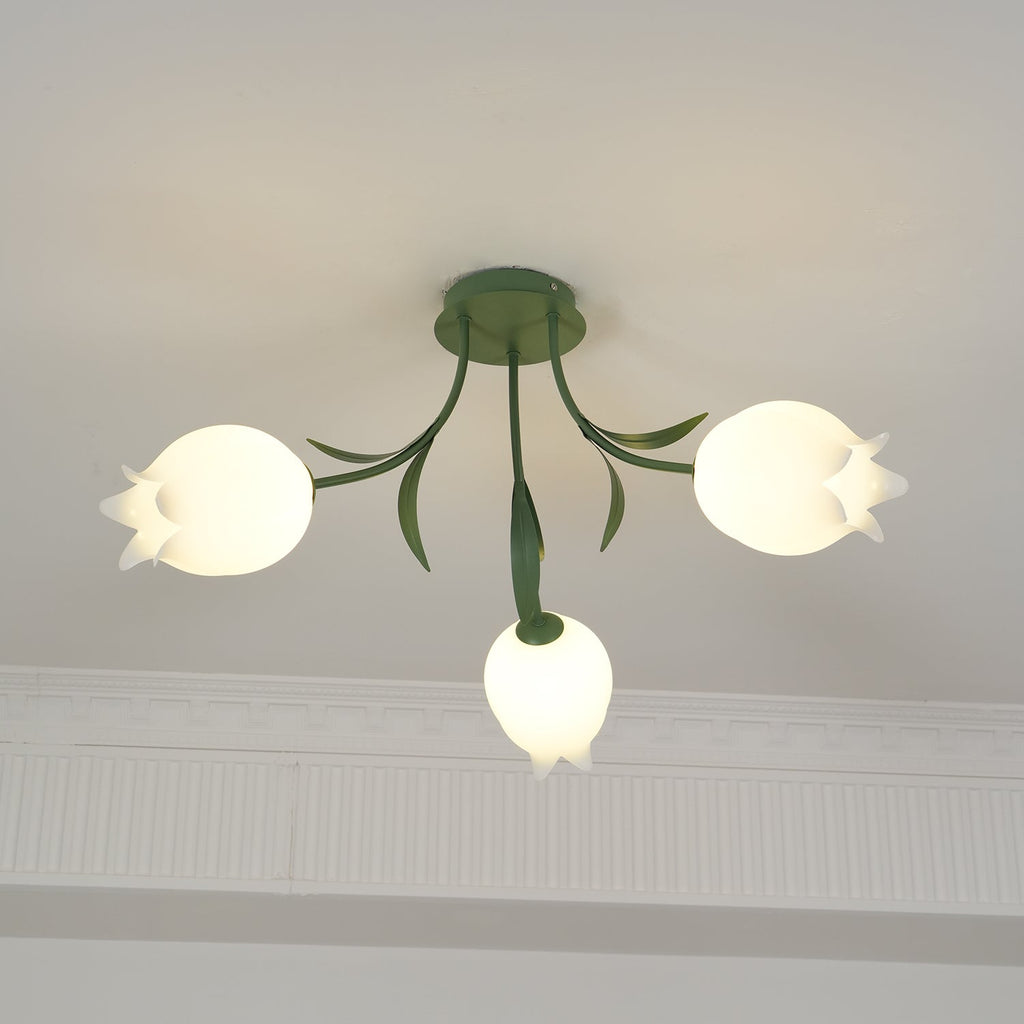 Hanging near a cove moulding, this Clérachic ceiling light in green shows its stem and leaves above the shades.
