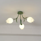 Framed slightly wider than a previous view, this three-shade Clérachic ceiling light in green hangs near a cove moulding.