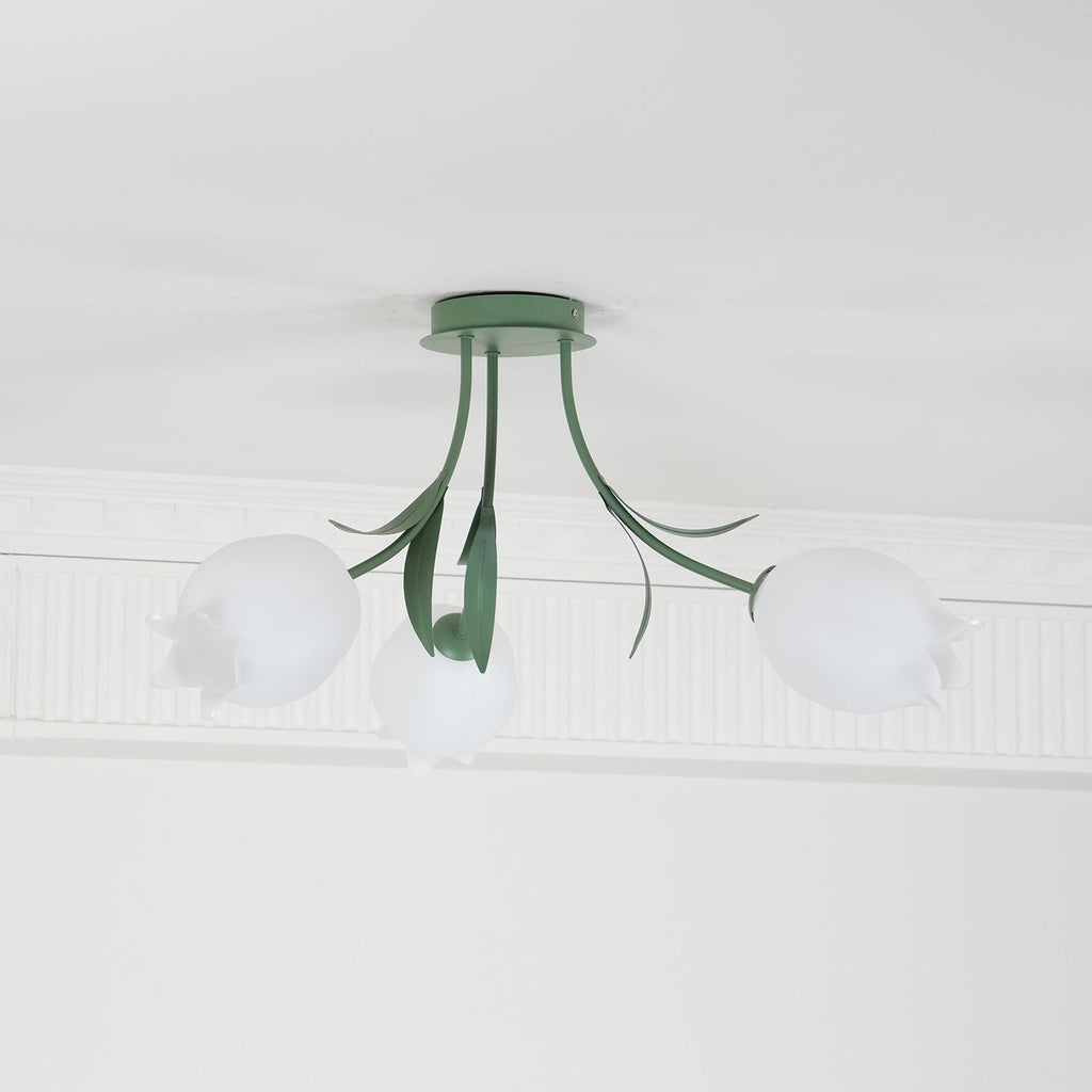 Mounted on a plain white ceiling, this Clérachic ceiling light in green shows its three shades unlit and evenly spaced.