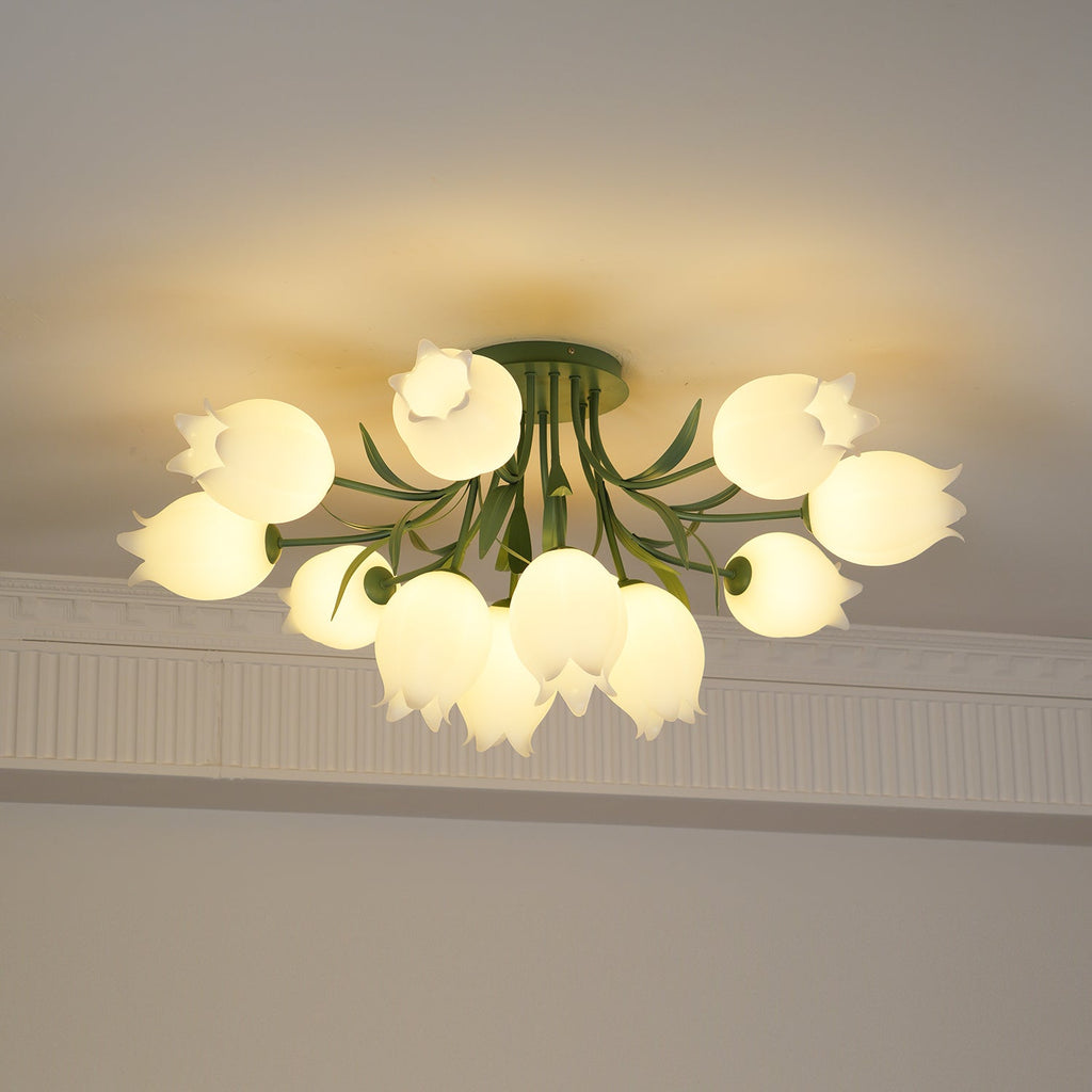 Glowing warm beneath a cove moulding, this Clérachic ceiling light in green has its dense cluster of shades lit throughout.