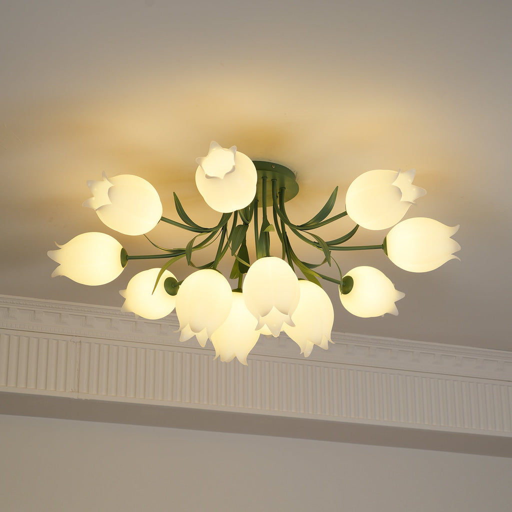 Glowing warm beneath a cove moulding, this Clérachic ceiling light in green has its dense cluster of shades fully lit.