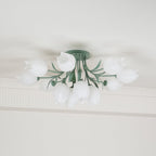 Partly cropped in this view, this Clérachic ceiling light in green shows a portion of its unlit cluster of shades.