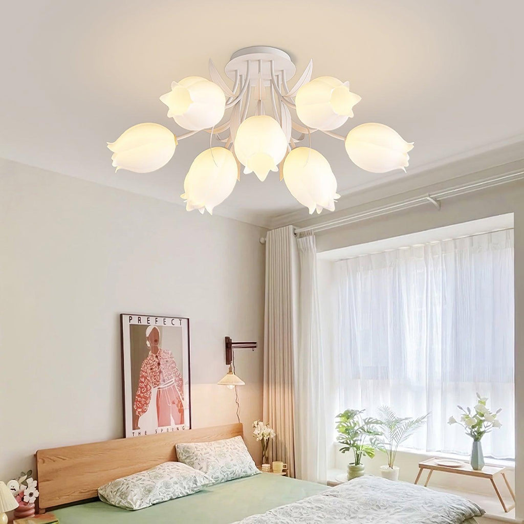 Mounted above a bedroom with a wood headboard, this Clérachic ceiling light in green hangs near a framed print and sheer curtains.