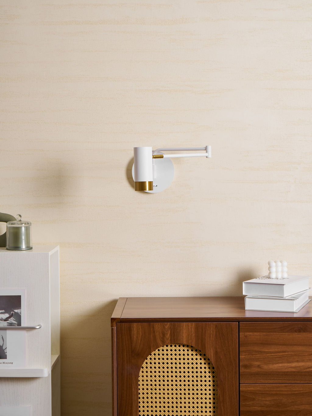 Swing arm wall lamp with elongated gold-accented shade