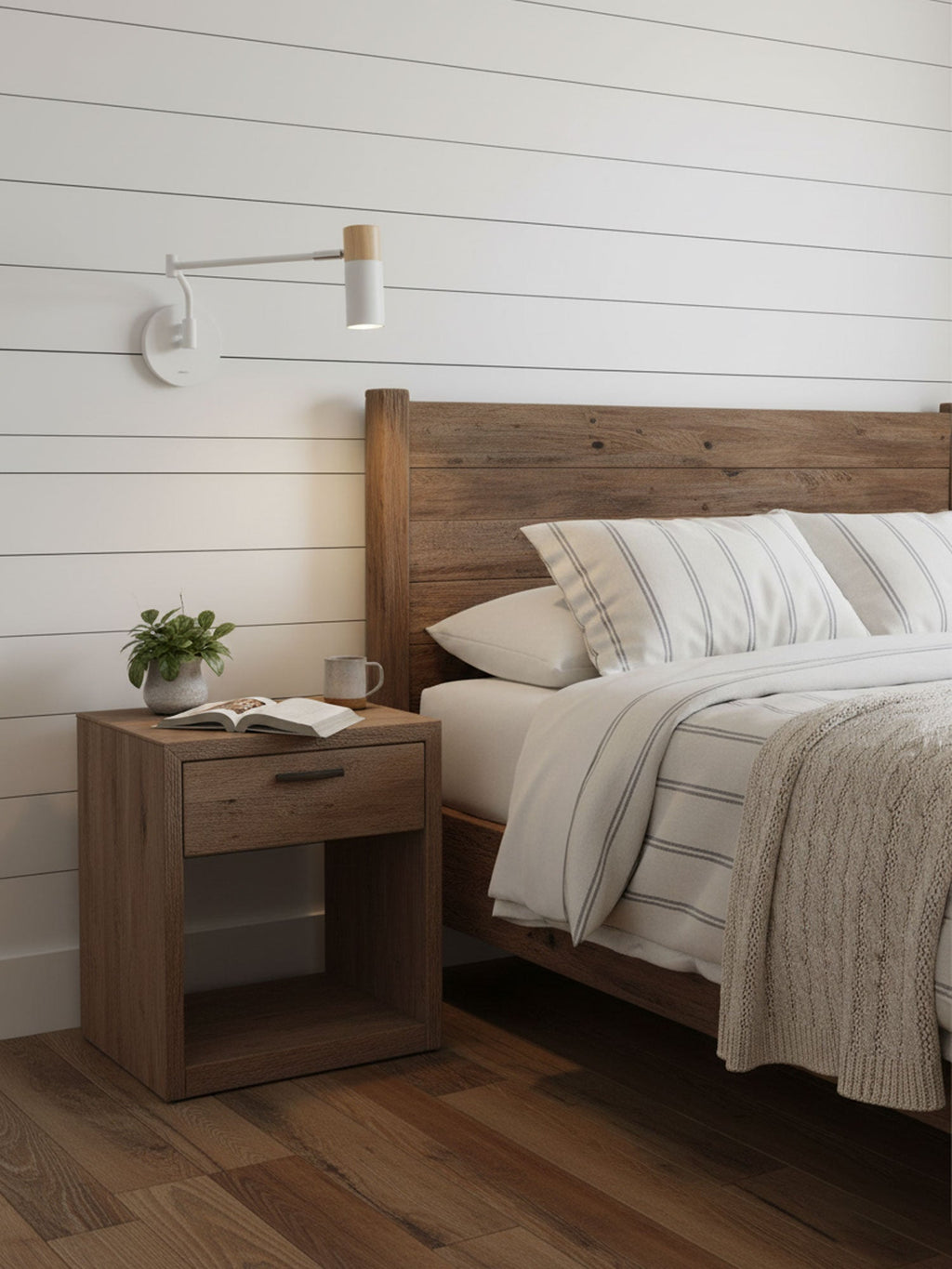 White and gold swing arm wall lamp beside a headboard