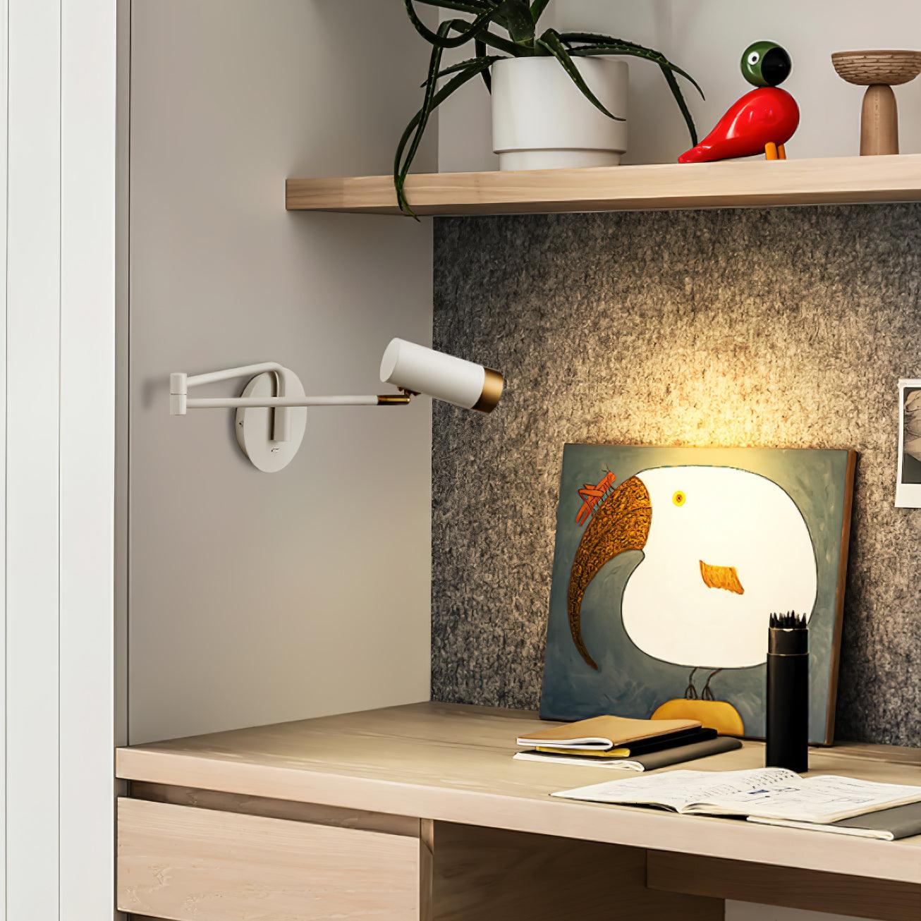 White and gold swing arm wall lamp in a bright bedroom