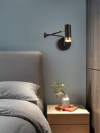 Swing arm wall lamp shown lit in a cosy interior