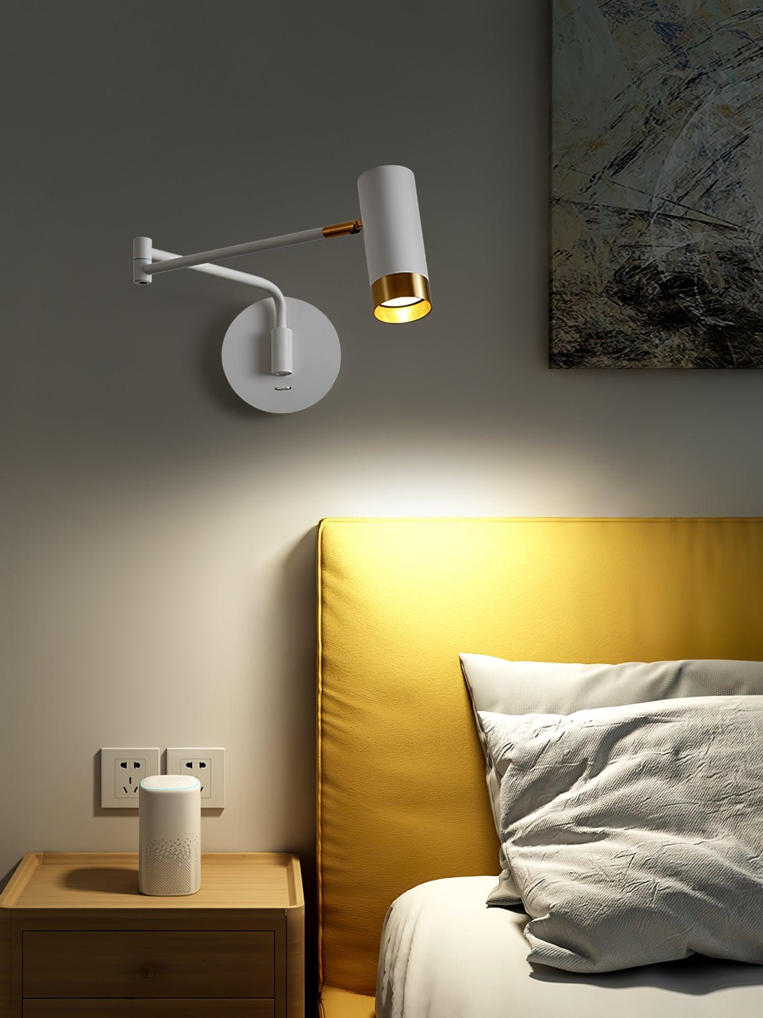 Adjustable swing arm wall lamp with shade angled down