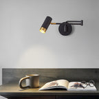 White and gold swing arm wall lamp styled above a chair