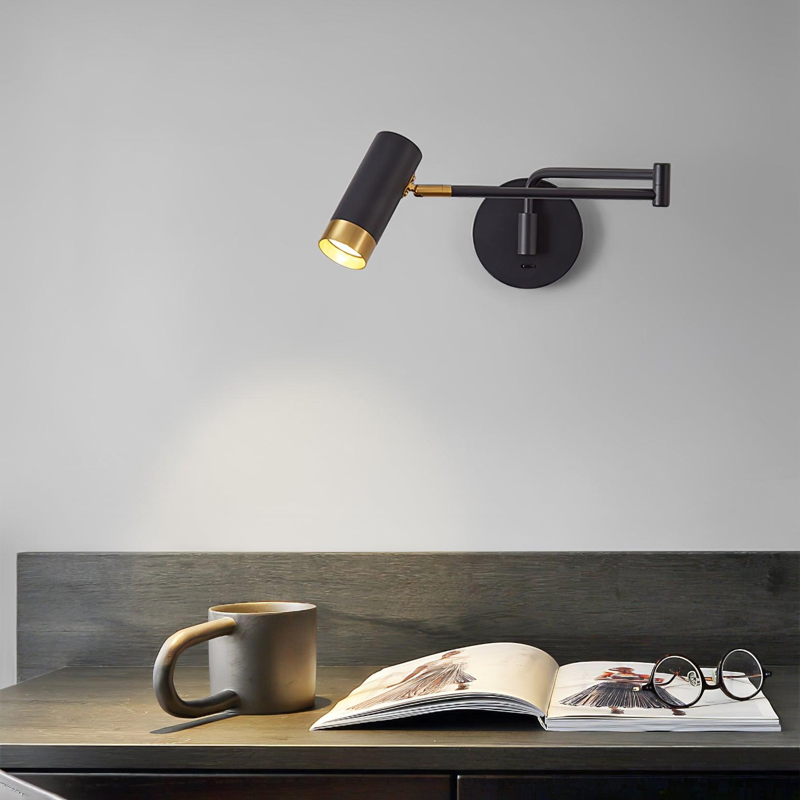 White and gold swing arm wall lamp styled above a chair